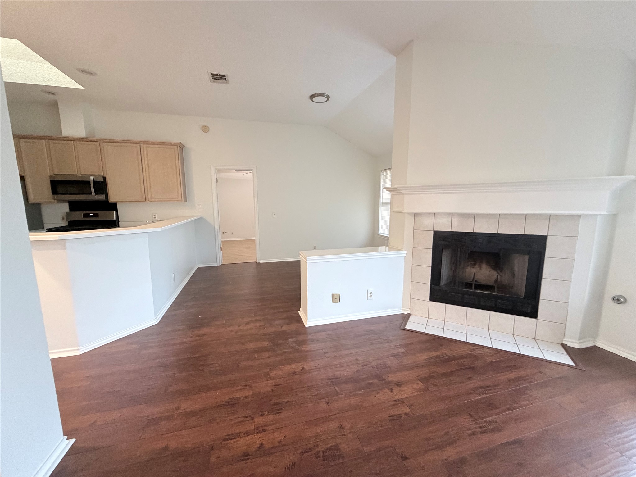 20809 Pacers Gait Lane Pflugerville, TX 78660 - Photo 9 of 23 a view of kitchen with stainless steel appliances wooden floor sink and stove