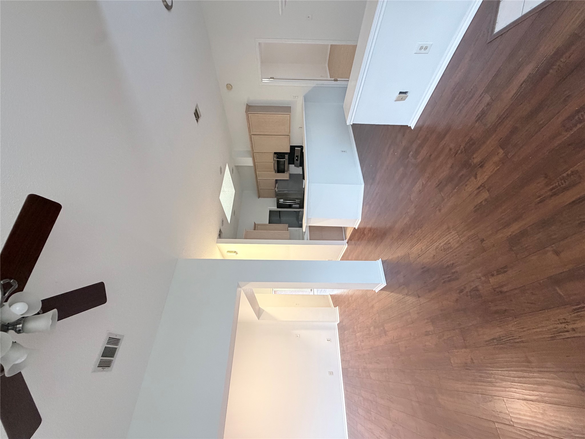 20809 Pacers Gait Lane Pflugerville, TX 78660 - Photo 10 of 23 a view of a kitchen and wooden floor