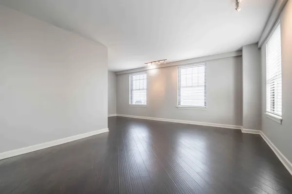 a view of a room with wooden floor