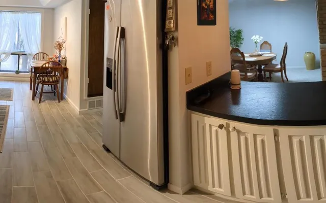 a kitchen with sink and cabinets