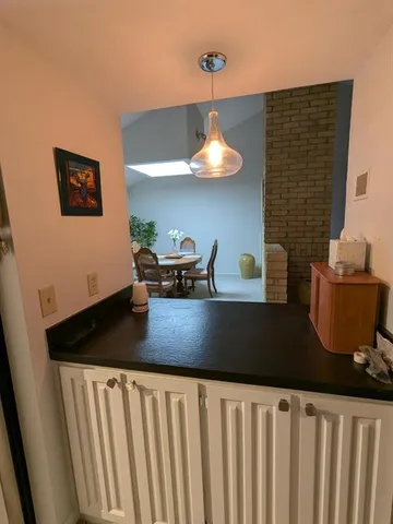 a table with a vase and flowers on it