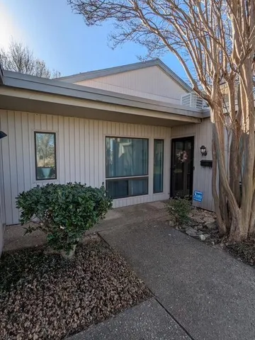 a view of a house with a small garden