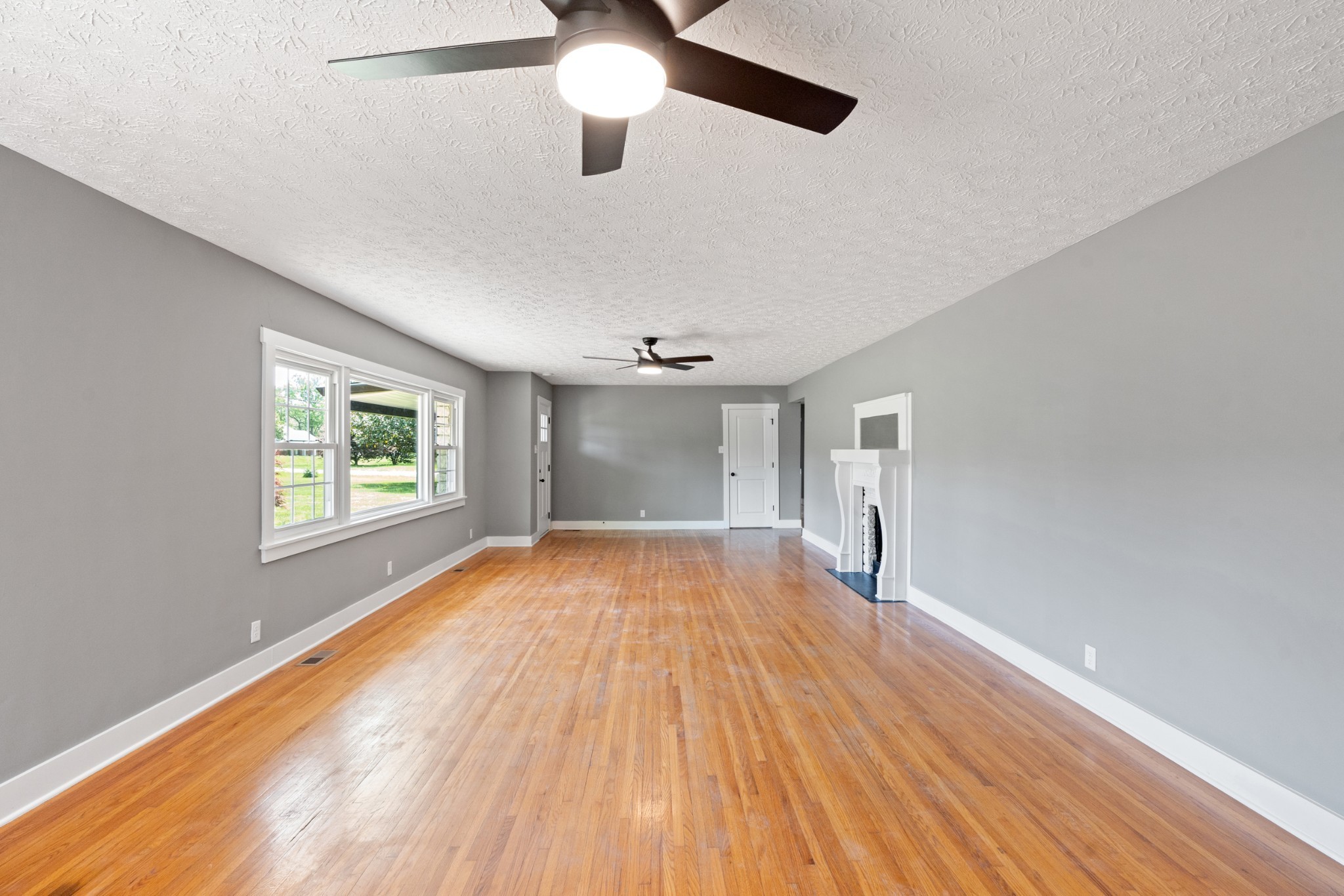 1503 5th Avenue West Springfield, TN 37172 - Photo 11 of 43 a view of empty room with wooden floor and fan