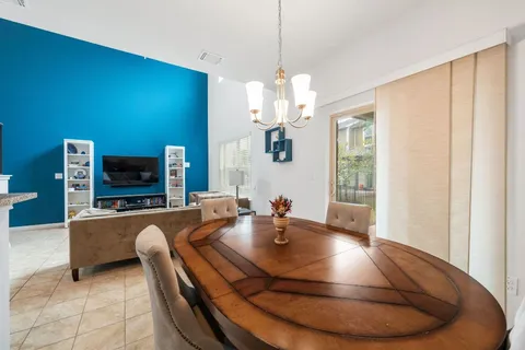 a living room with fireplace furniture and a flat screen tv