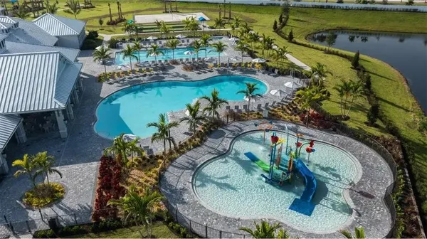 an aerial view of a house with a yard basket ball court