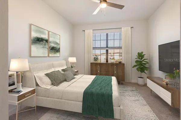 a bedroom with a large bed and a flat screen tv