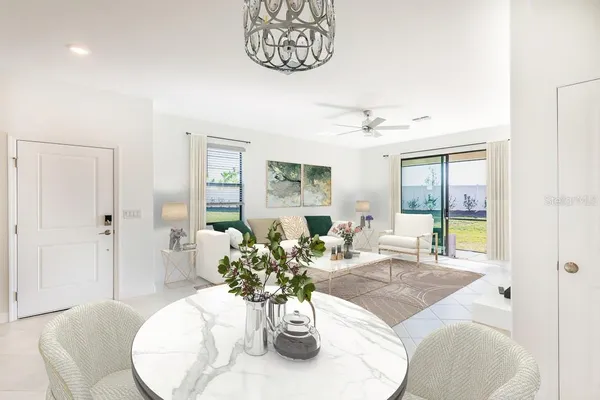 a view of a dining room with furniture window and wooden floor