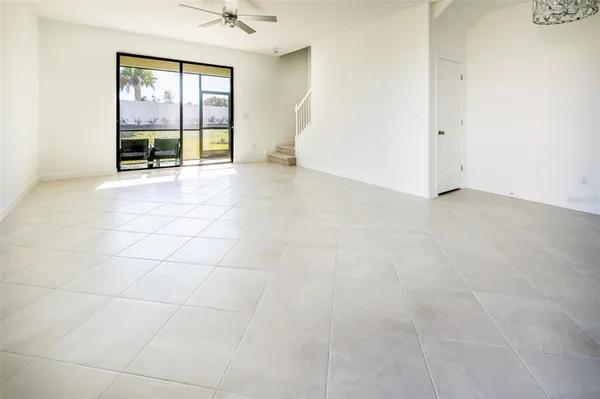 a view of an empty room with a window