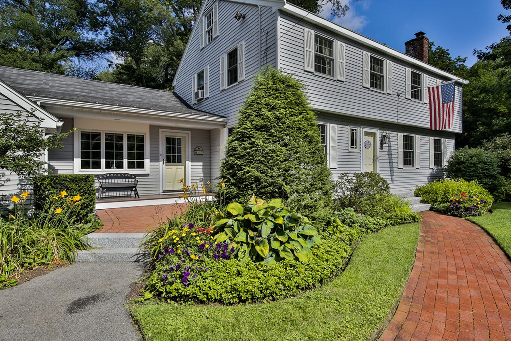 49 Porter Road Andover, MA 01810 - Photo 1 of 24 a front view of a house with a garden