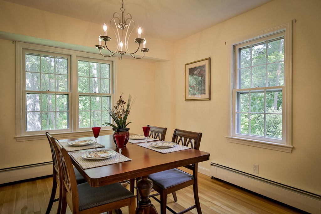 49 Porter Road Andover, MA 01810 - Photo 15 of 24 a view of a dining room with furniture a chandelier and wooden floor