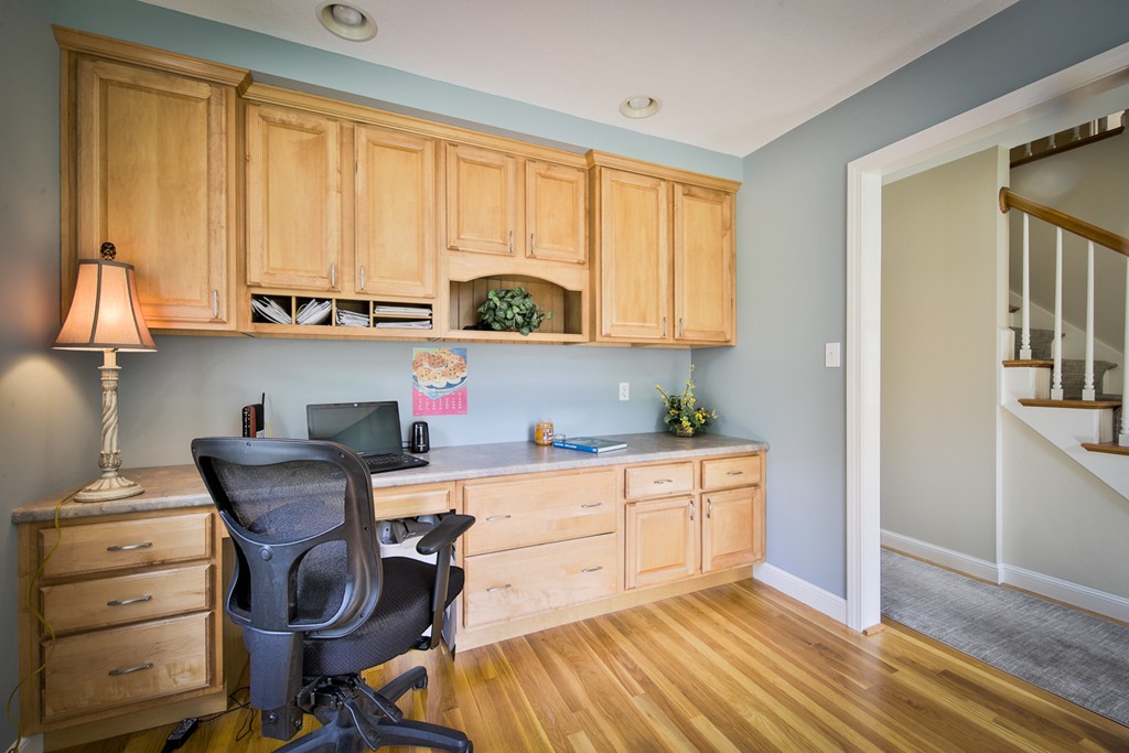 49 Porter Road Andover, MA 01810 - Photo 19 of 24 a kitchen with a stove a sink cabinets and wooden floor