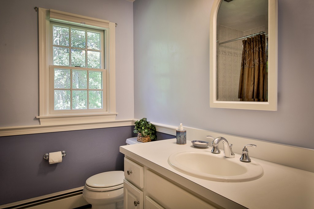 49 Porter Road Andover, MA 01810 - Photo 20 of 24 a bathroom with a sink toilet and mirror