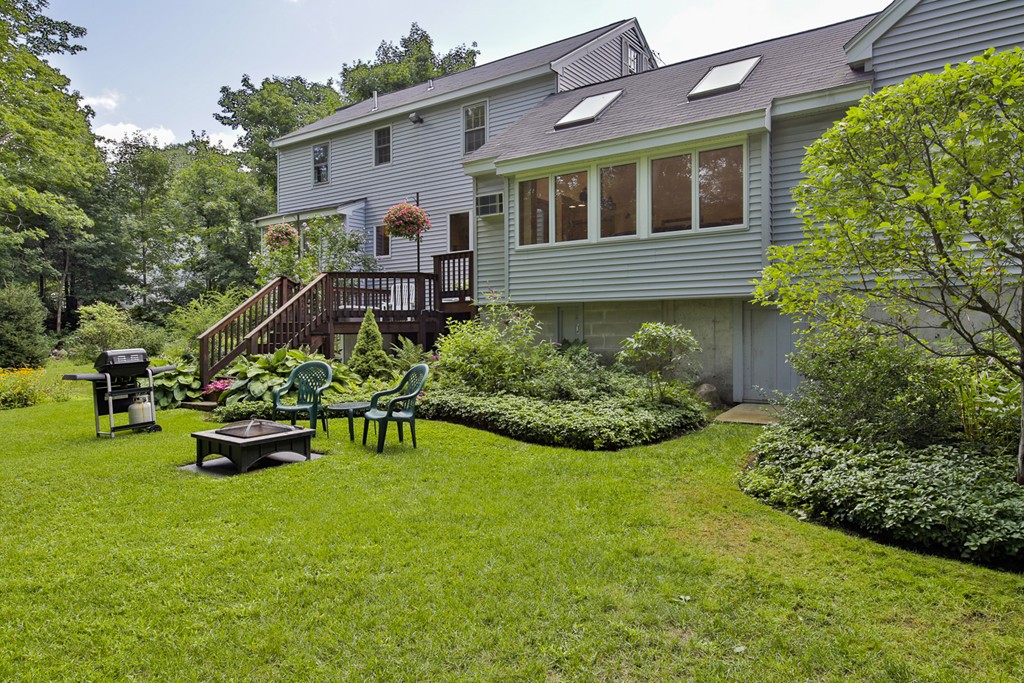 49 Porter Road Andover, MA 01810 - Photo 3 of 24 a front view of a house with a garden