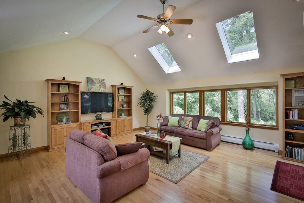 49 Porter Road Andover, MA 01810 - Photo 6 of 24 a living room with furniture and a flat screen tv