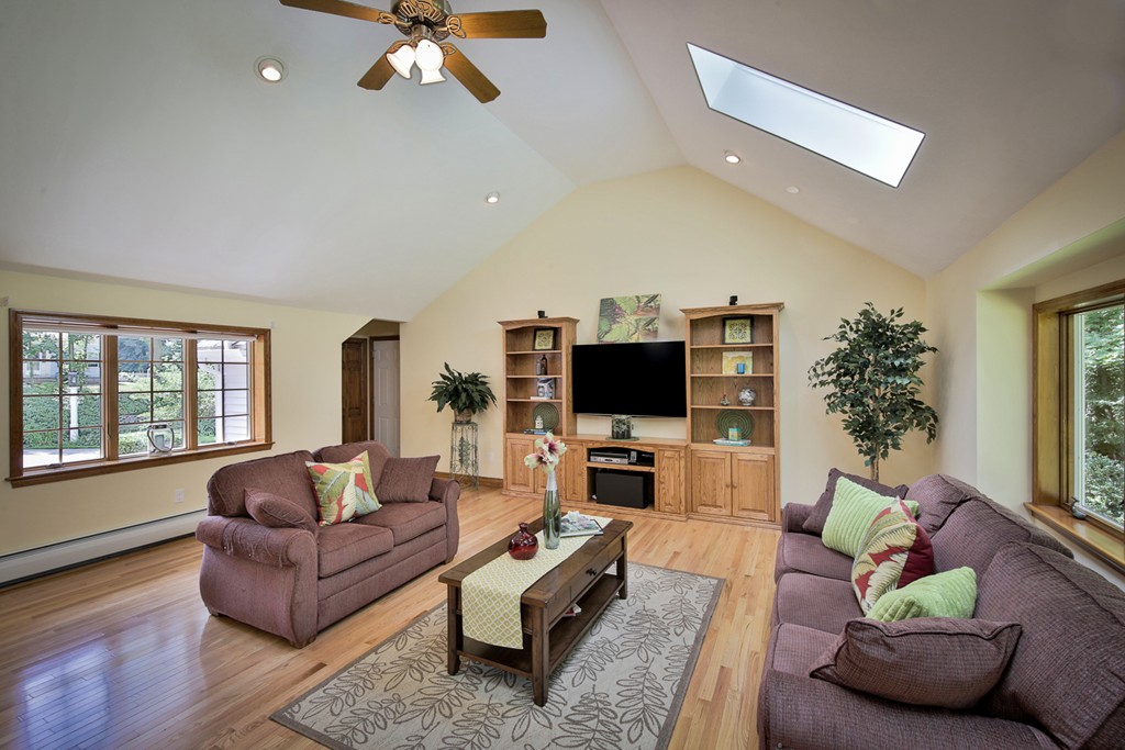 49 Porter Road Andover, MA 01810 - Photo 7 of 24 a living room with furniture and a flat screen tv