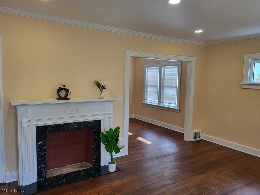 955 Nela View Road Cleveland Heights, OH 44112 - Photo 5 of 34 Living room featuring ornamental molding, a high end fireplace, and dark wood-type flooring