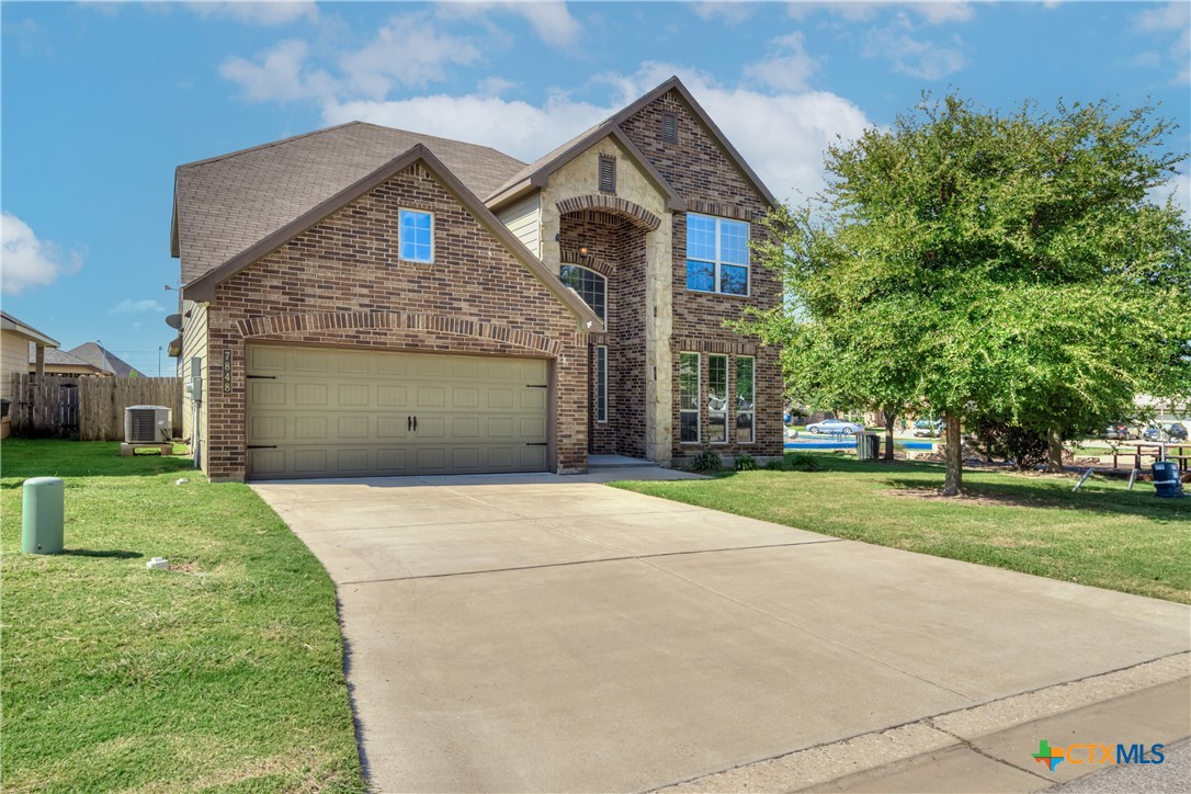 7848 Old Gate Road Temple, TX 76502 - Photo 1 of 32 a front view of a house with a yard and garage