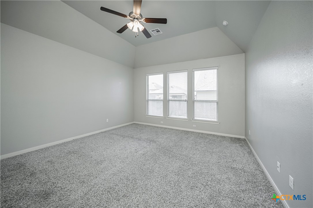 7848 Old Gate Road Temple, TX 76502 - Photo 19 of 32 an empty room with a window and a fan