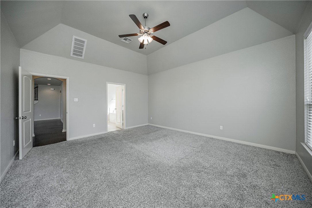 7848 Old Gate Road Temple, TX 76502 - Photo 20 of 32 an empty room with fan and windows