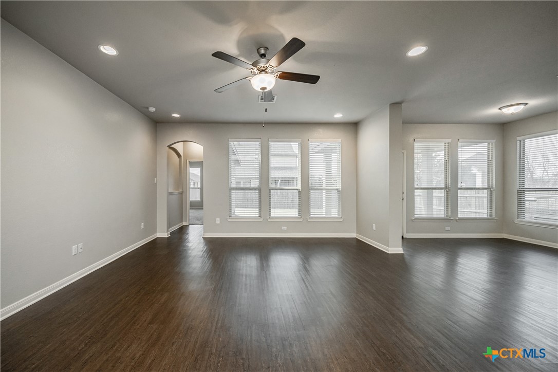 7848 Old Gate Road Temple, TX 76502 - Photo 10 of 32 a view of an empty room with wooden floor and a window