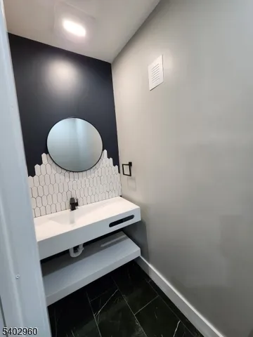 a room with a chair and a mirror