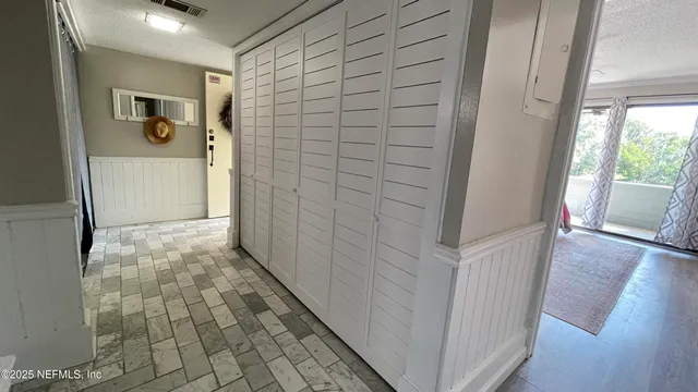 an aerial view of a house with a yard and garden