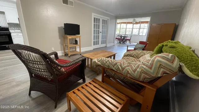 a bedroom with two beds and a mirror