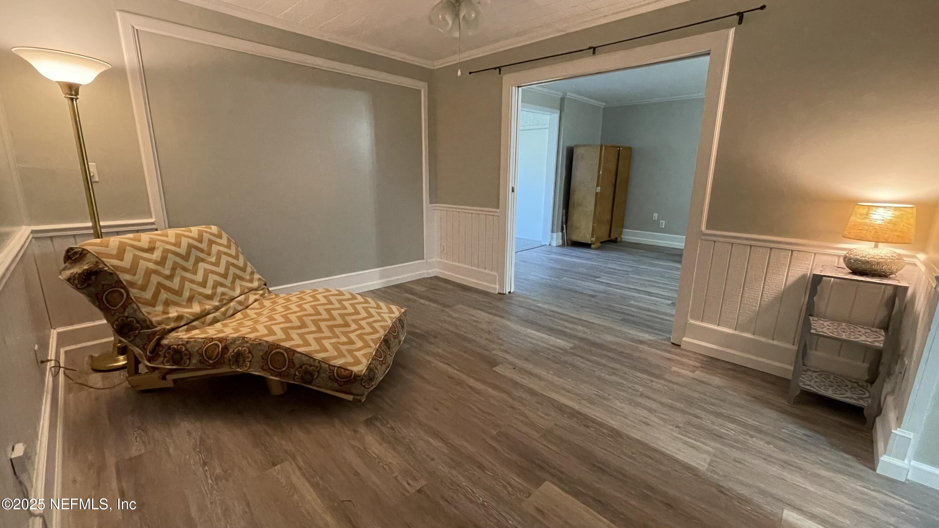 2510 Southwest 14th Drive Gainesville, FL 32608 - Photo 30 of 71 a living room with furniture and a wooden floor