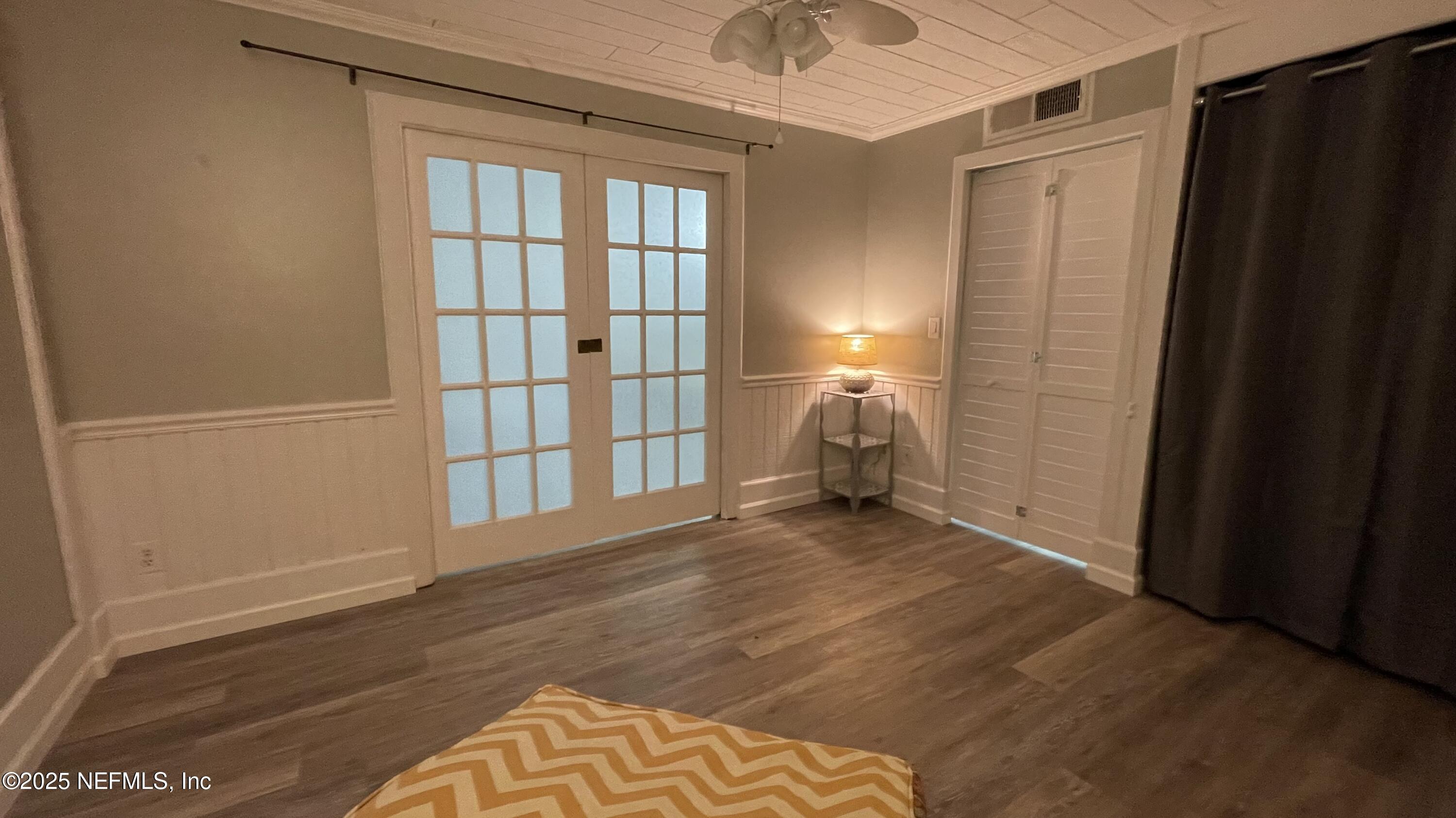2510 Southwest 14th Drive Gainesville, FL 32608 - Photo 33 of 71 a view of empty room with wooden floor and fan