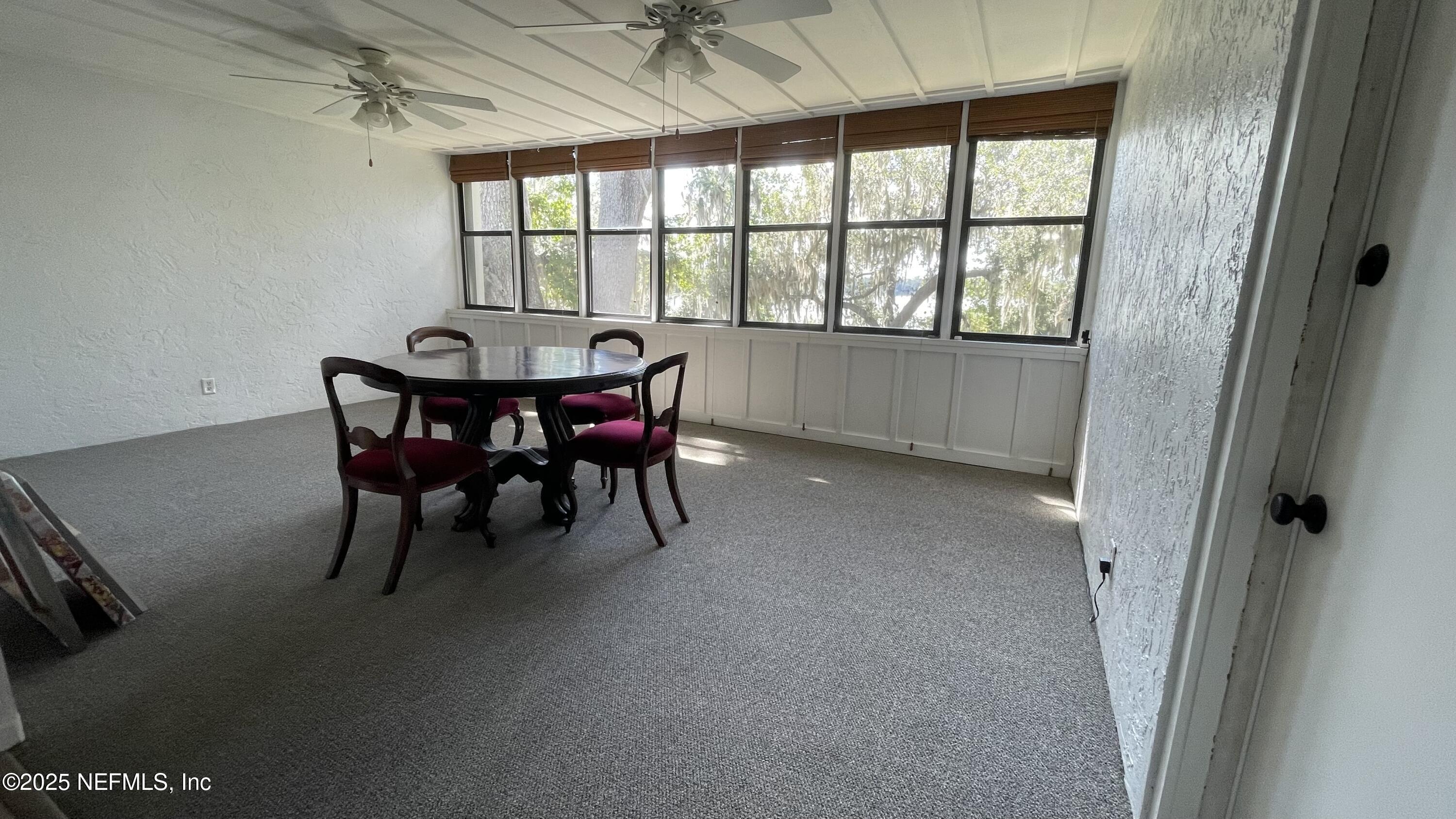 2510 Southwest 14th Drive Gainesville, FL 32608 - Photo 52 of 71 a view of a dining room with furniture window and outside view