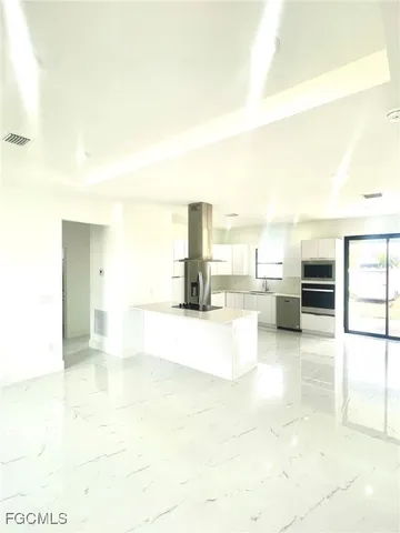 a view of a living room with furniture