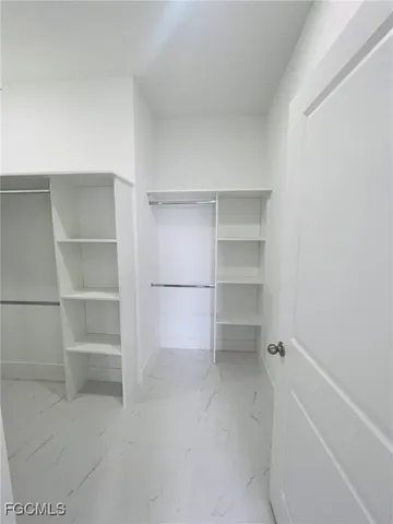 a view of an empty walk in closet
