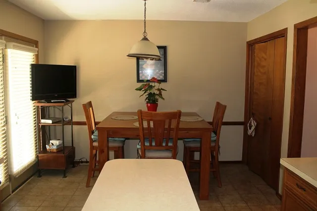 a view of a livingroom with furniture and a flat screen tv