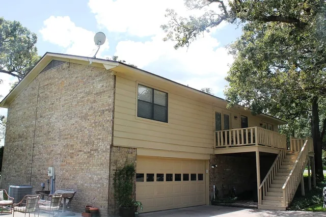 a front view of a house with parking space