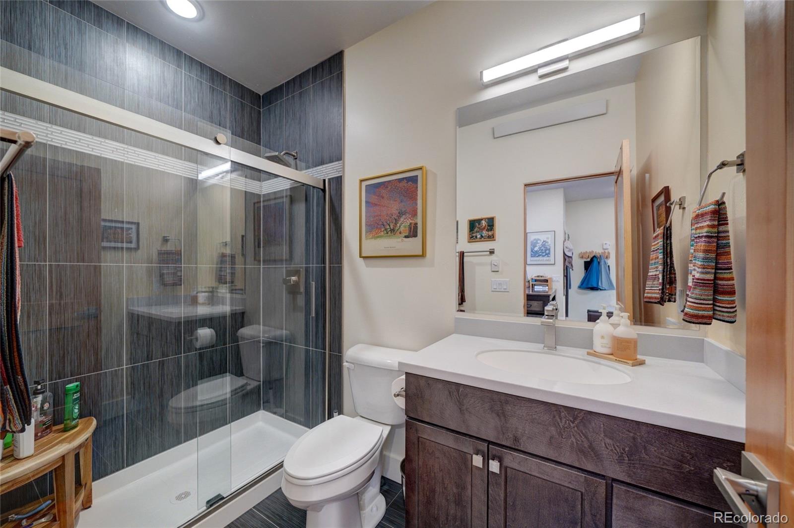 108 Old Stage Road, Unit C Salida, CO 81201 - Photo 18 of 30 a bathroom with a sink toilet and shower