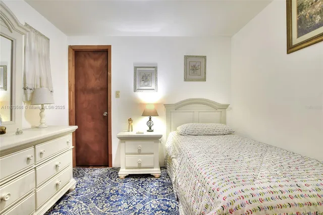 a bedroom with a bed and a closet