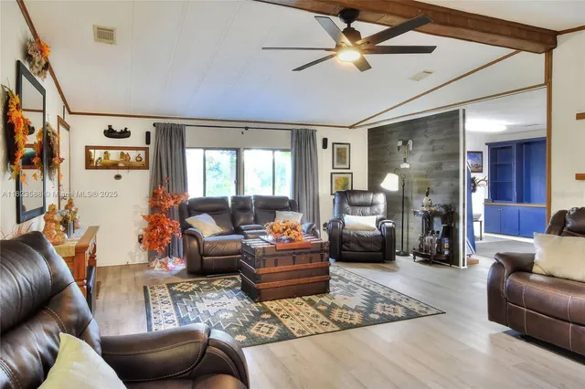 a living room with furniture and a window