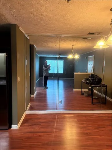 a lobby with furniture and wooden floor