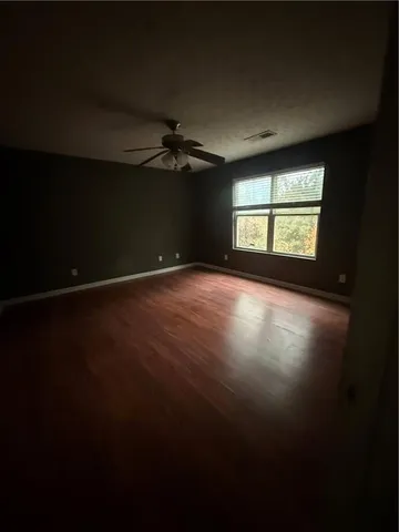 a view of an empty room with windows