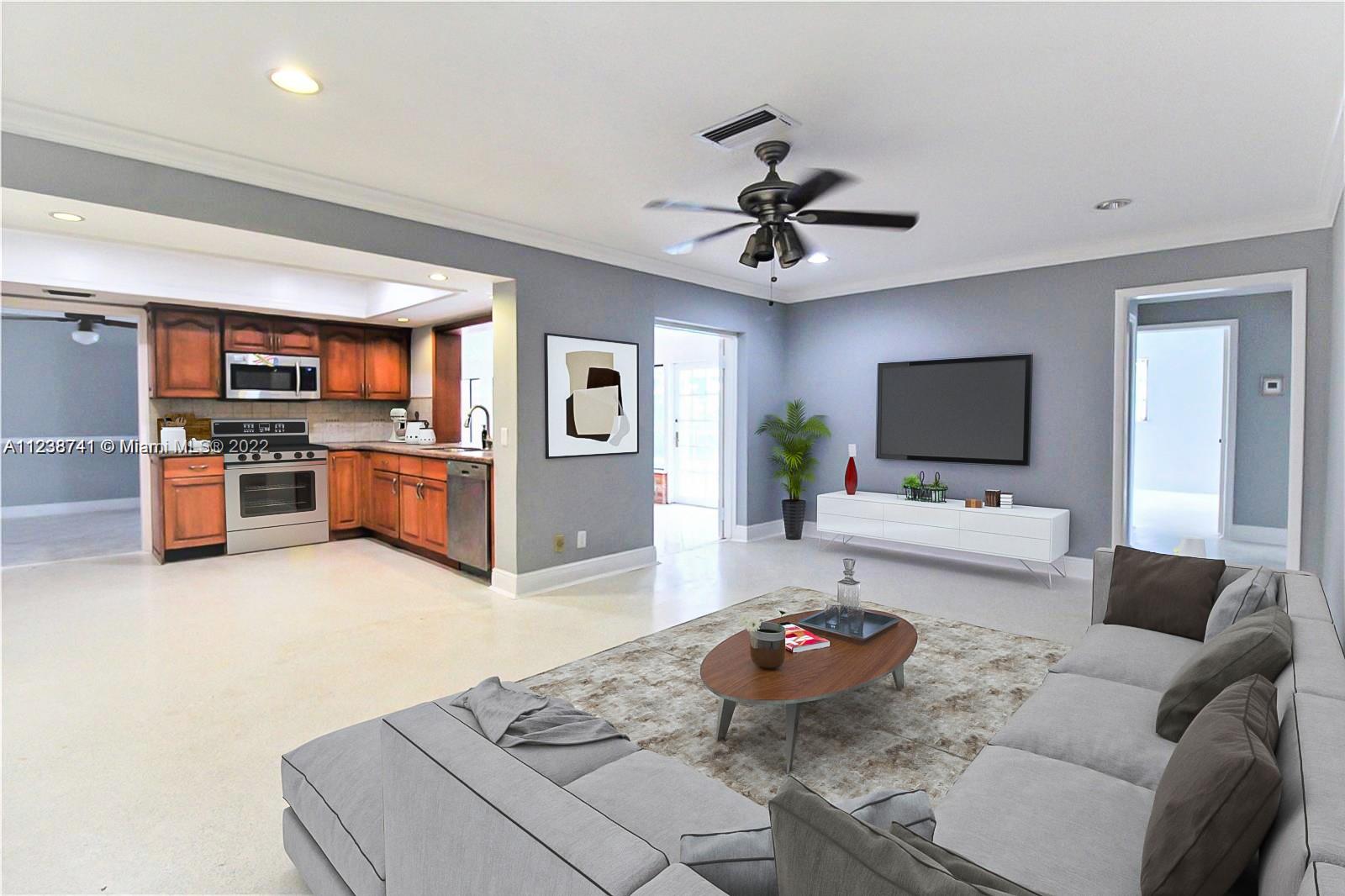 a living room with furniture and a flat screen tv