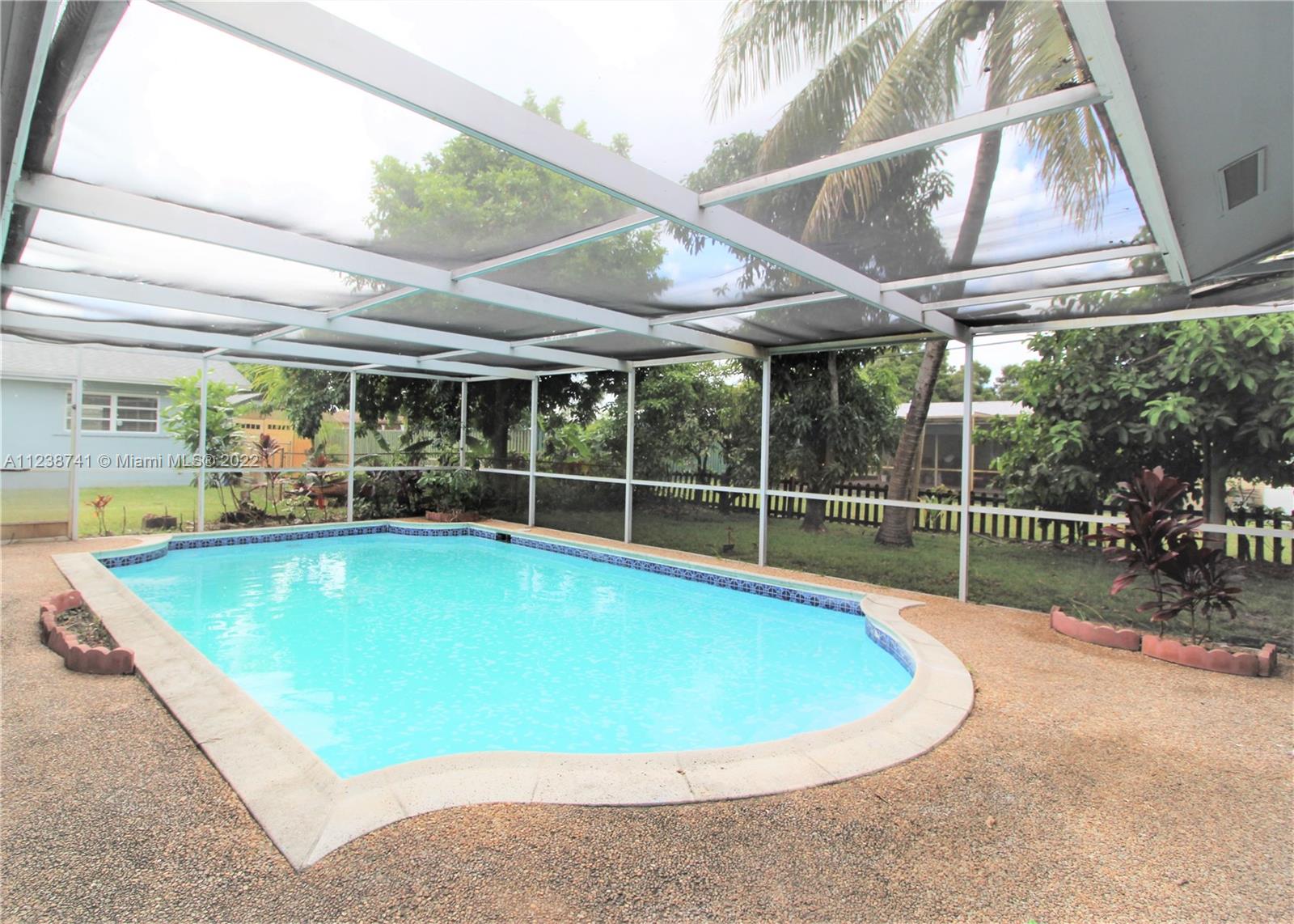 5261 Southwest 9th Street Plantation, FL 33317 - Photo 15 of 27 a view of a backyard with a swimming pool