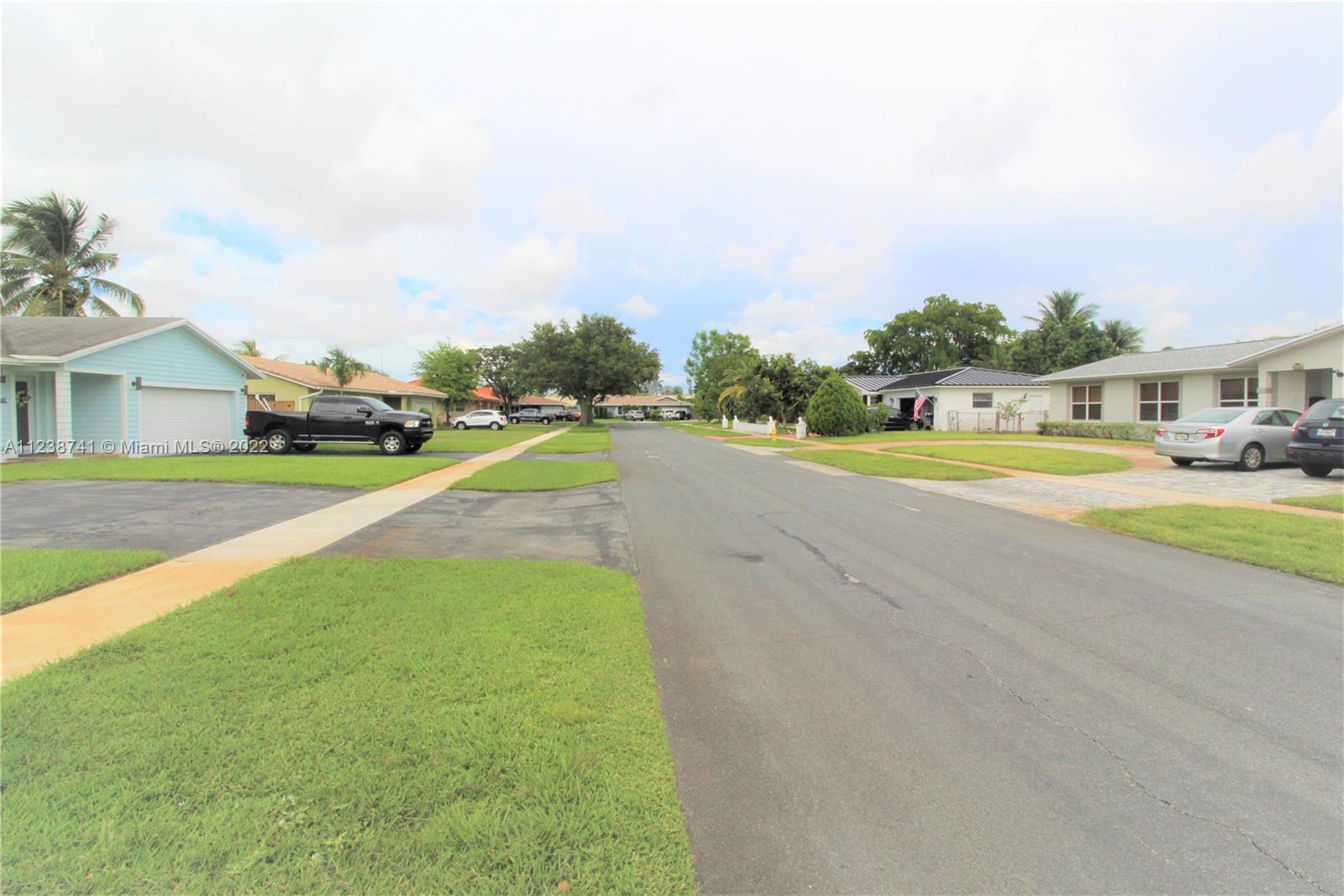 5261 Southwest 9th Street Plantation, FL 33317 - Photo 18 of 27 a view of an and swimming pool with an outdoor space and seating area