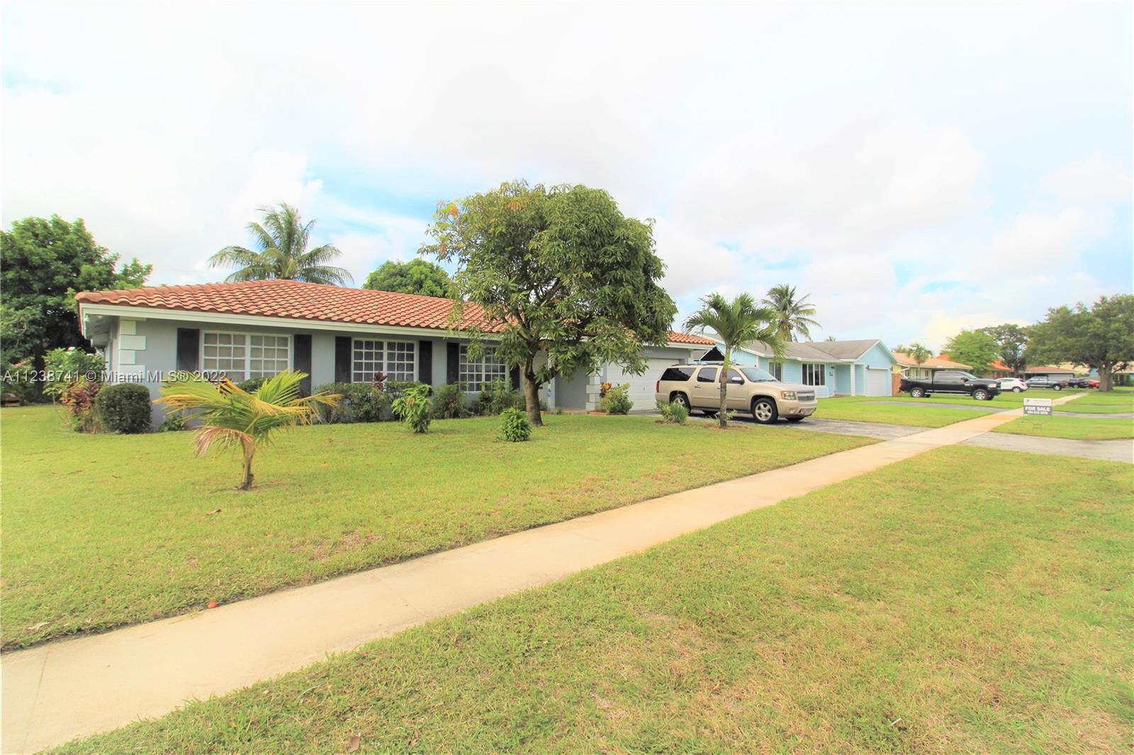 5261 Southwest 9th Street Plantation, FL 33317 - Photo 19 of 27 a view of an house with backyard and swimming pool