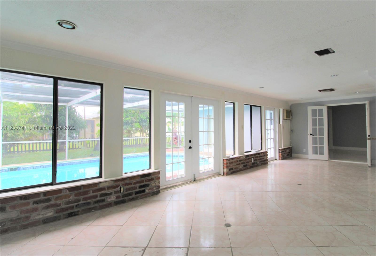 5261 Southwest 9th Street Plantation, FL 33317 - Photo 20 of 27 a view of an empty room with a window
