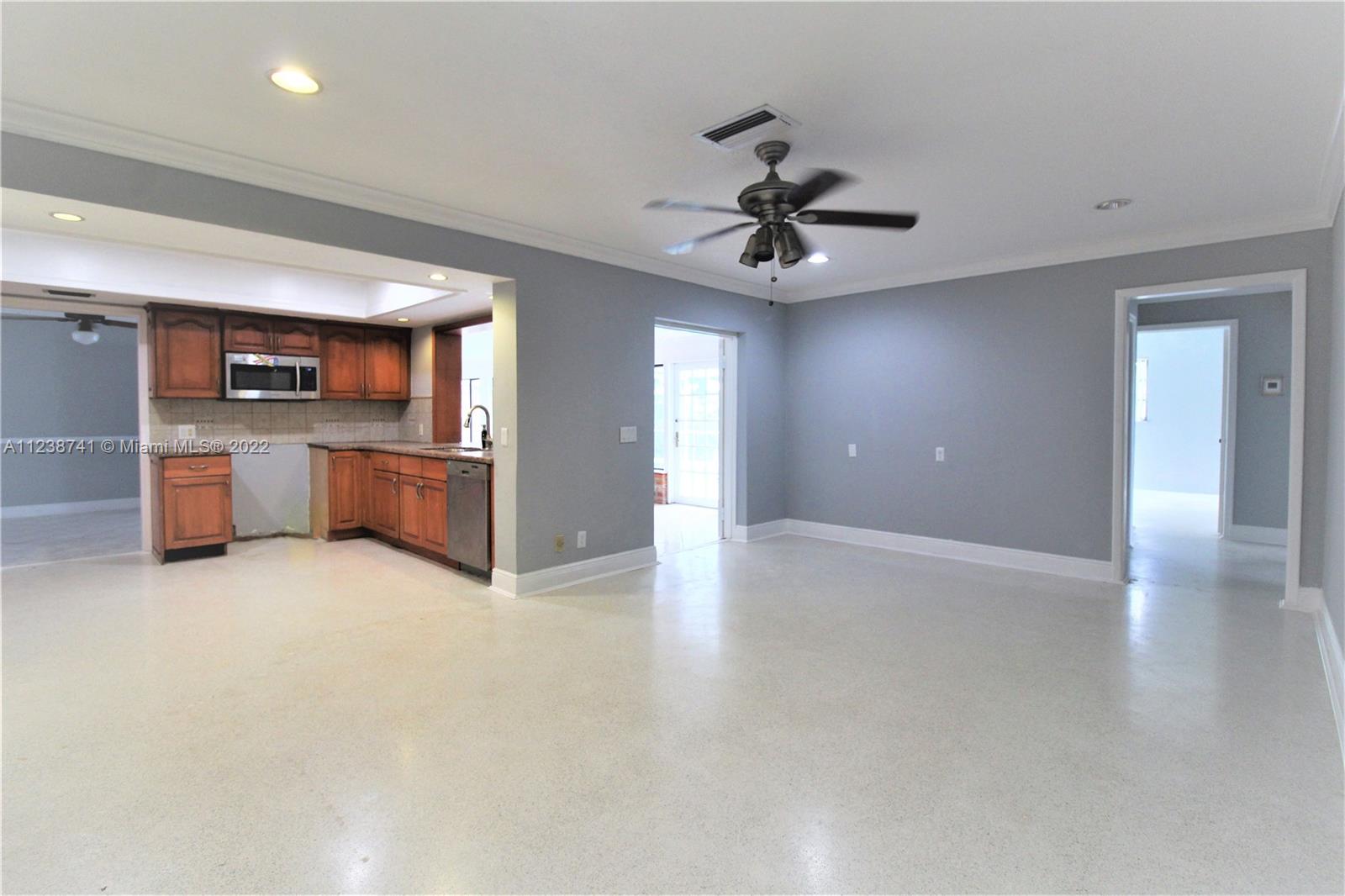 5261 Southwest 9th Street Plantation, FL 33317 - Photo 23 of 27 a view of a kitchen with a sink and a stove top oven