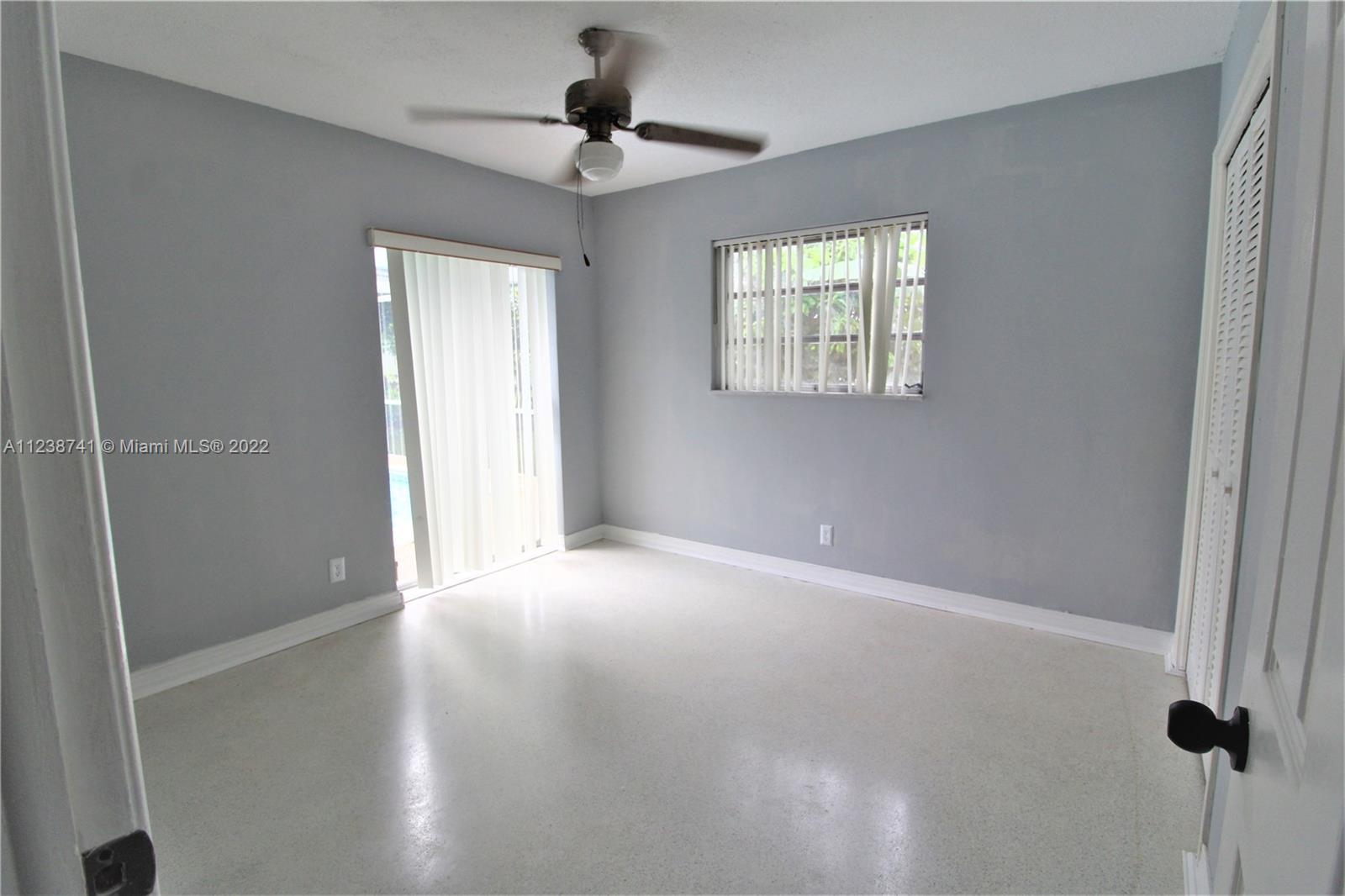 5261 Southwest 9th Street Plantation, FL 33317 - Photo 24 of 27 a view of an empty room with a window