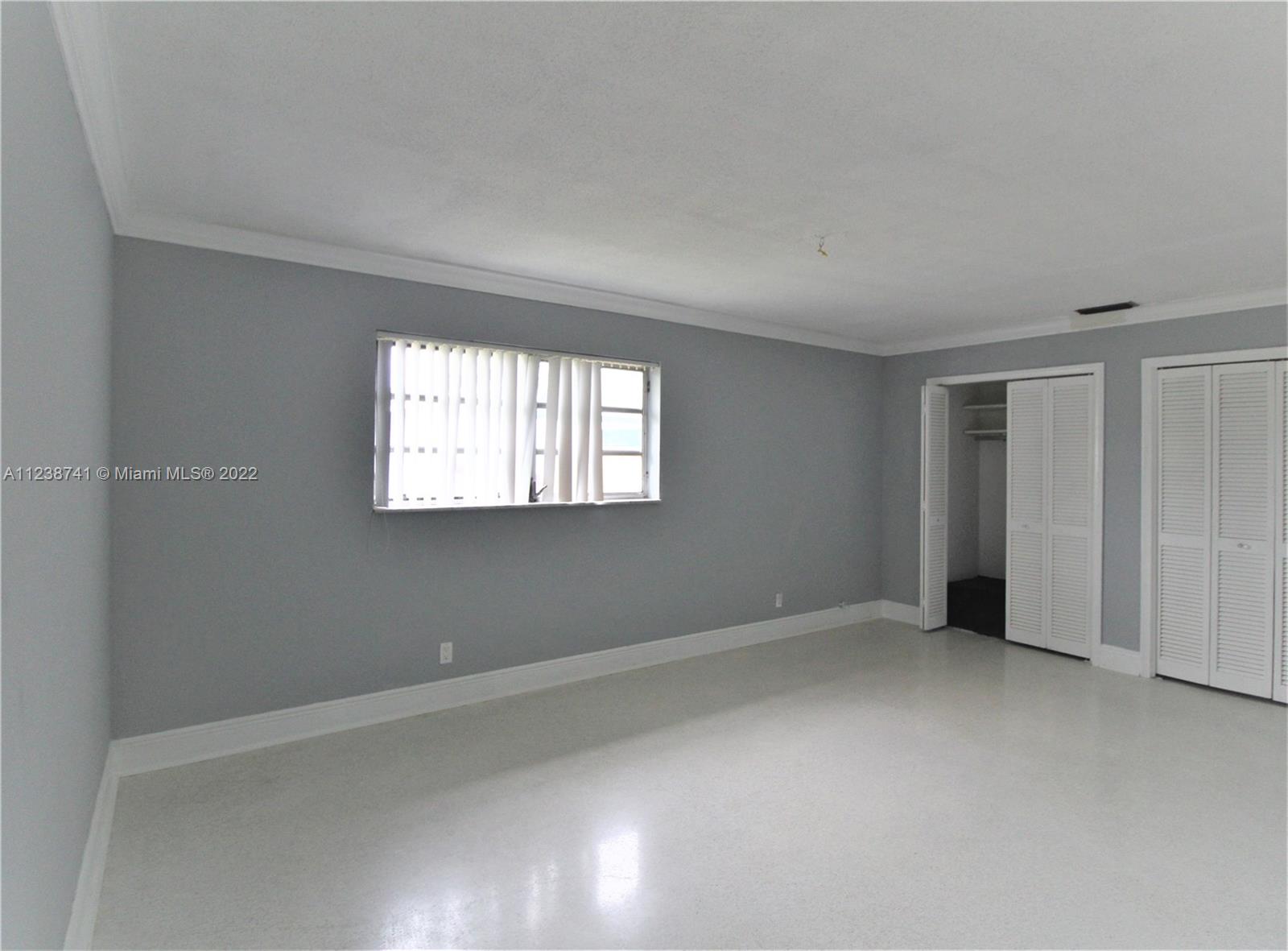 5261 Southwest 9th Street Plantation, FL 33317 - Photo 25 of 27 an empty room with windows