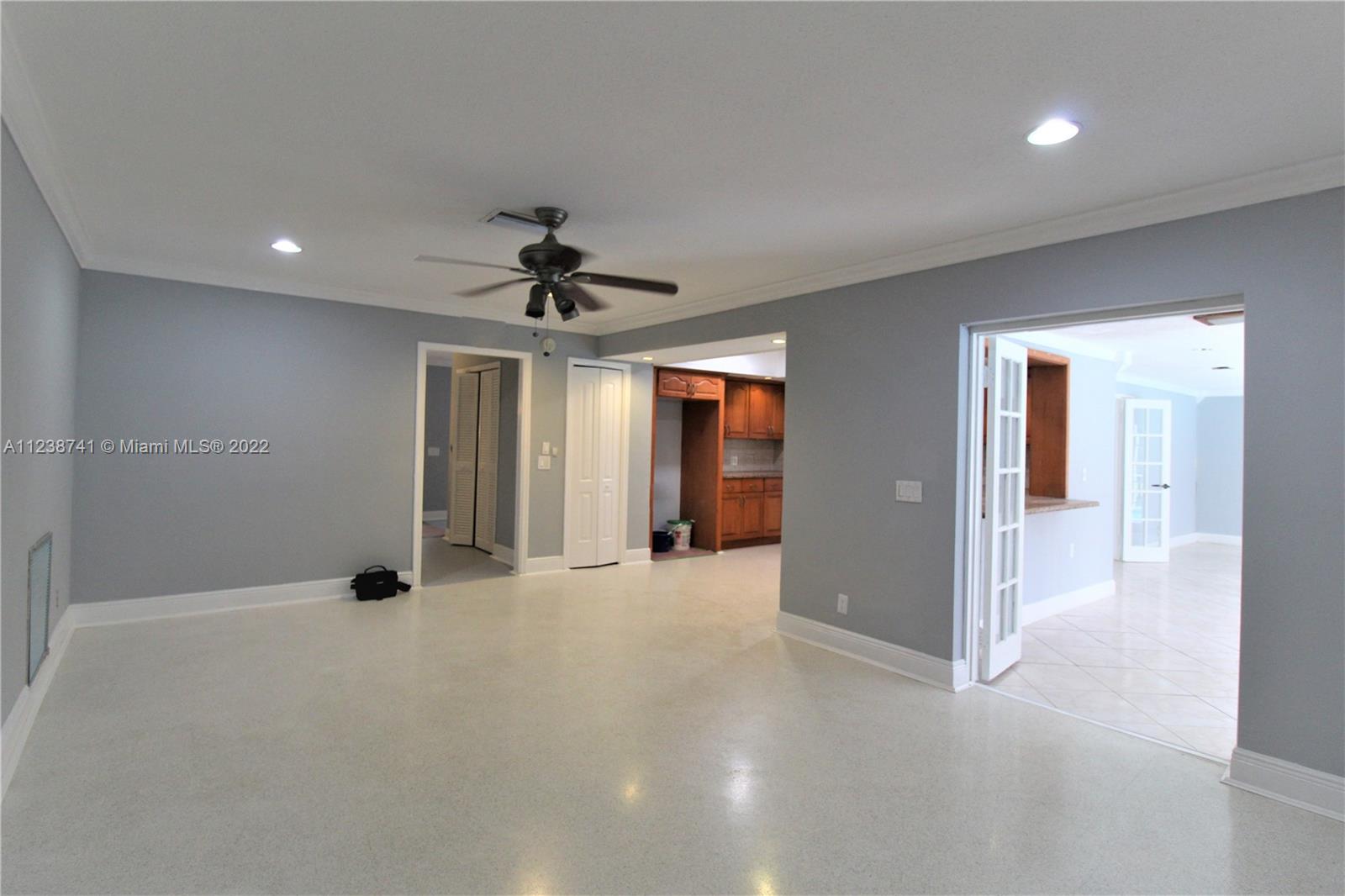5261 Southwest 9th Street Plantation, FL 33317 - Photo 27 of 27 a view of a big room with wooden floor and windows