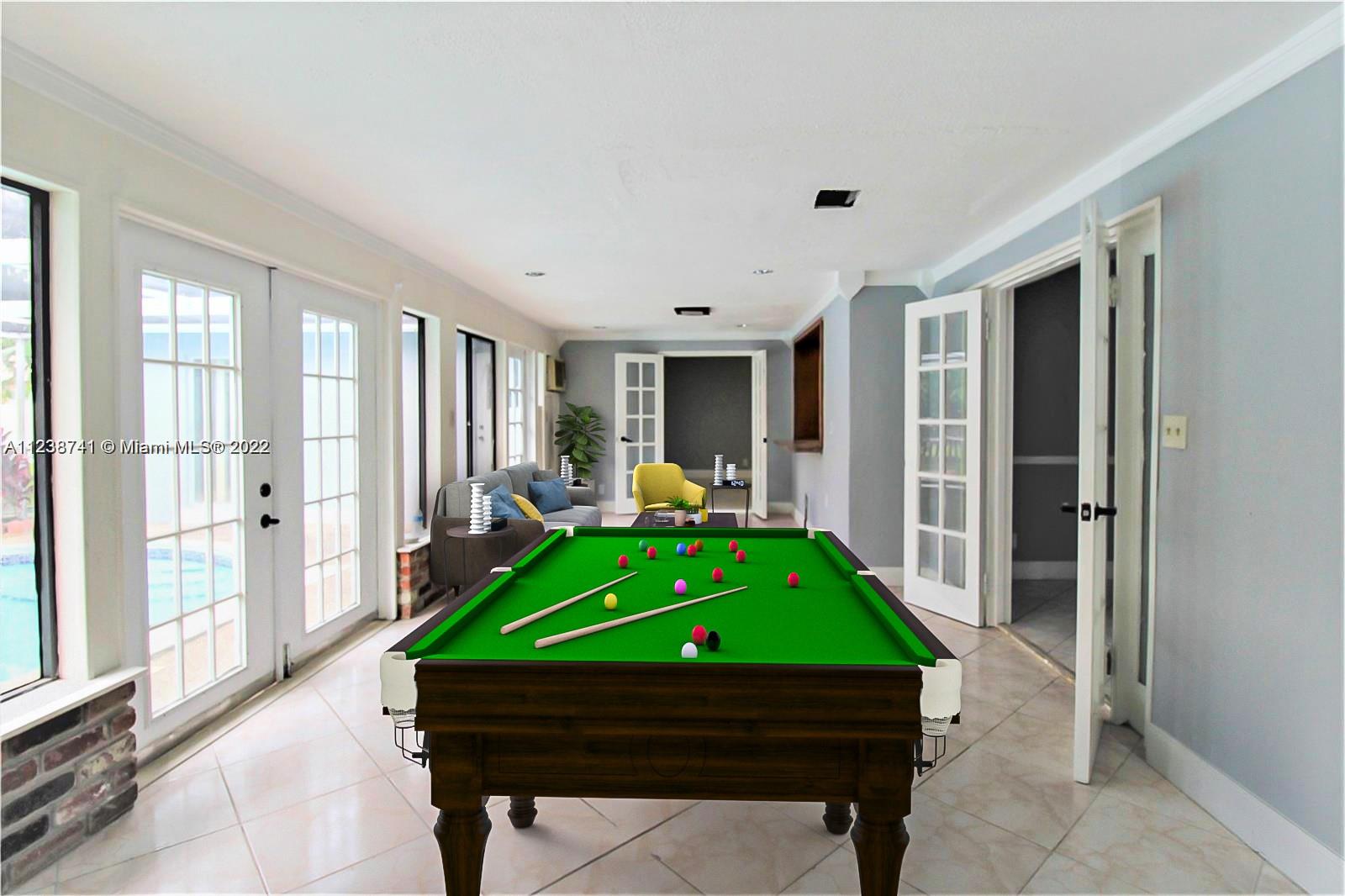 5261 Southwest 9th Street Plantation, FL 33317 - Photo 4 of 27 a room with a bed and a table