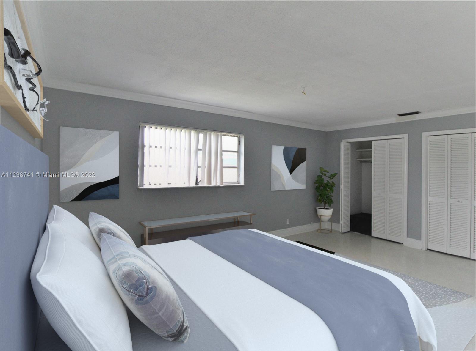 5261 Southwest 9th Street Plantation, FL 33317 - Photo 7 of 27 a bedroom with a bed and window